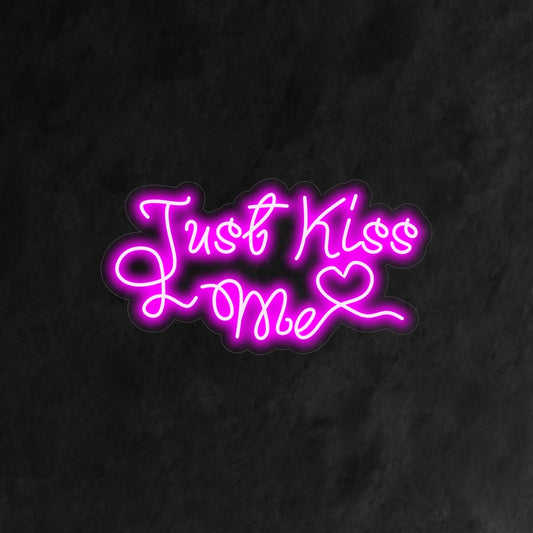"Just Kiss Me Neon Sign" - Illuminate your space with a romantic glow using this neon sign, adorned with the enchanting words "Just Kiss Me."