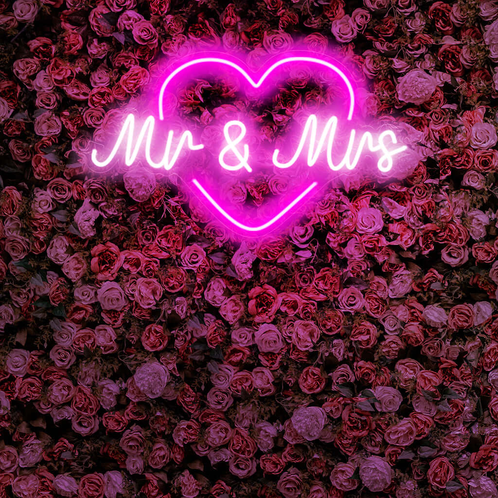 "Mr & Mrs With Heart Neon Sign" is a romantic and celebratory addition, perfect for spaces commemorating love and partnership. Illuminate with matrimonial warmth!