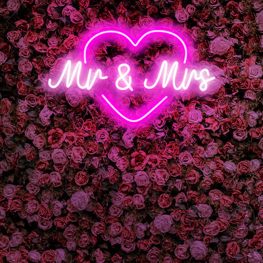 "Mr & Mrs With Heart Neon Sign" is a romantic and celebratory addition, perfect for spaces commemorating love and partnership. Illuminate with matrimonial warmth!