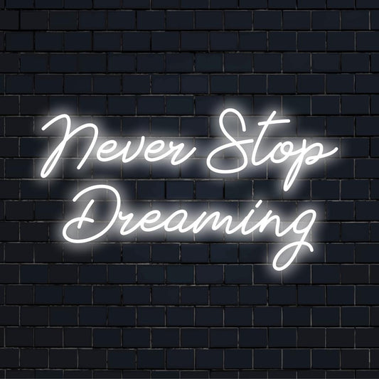 Bespoke LED neon sign with Never Stop Dreaming in bright, elegant letters; a glowing inspiration for any room.