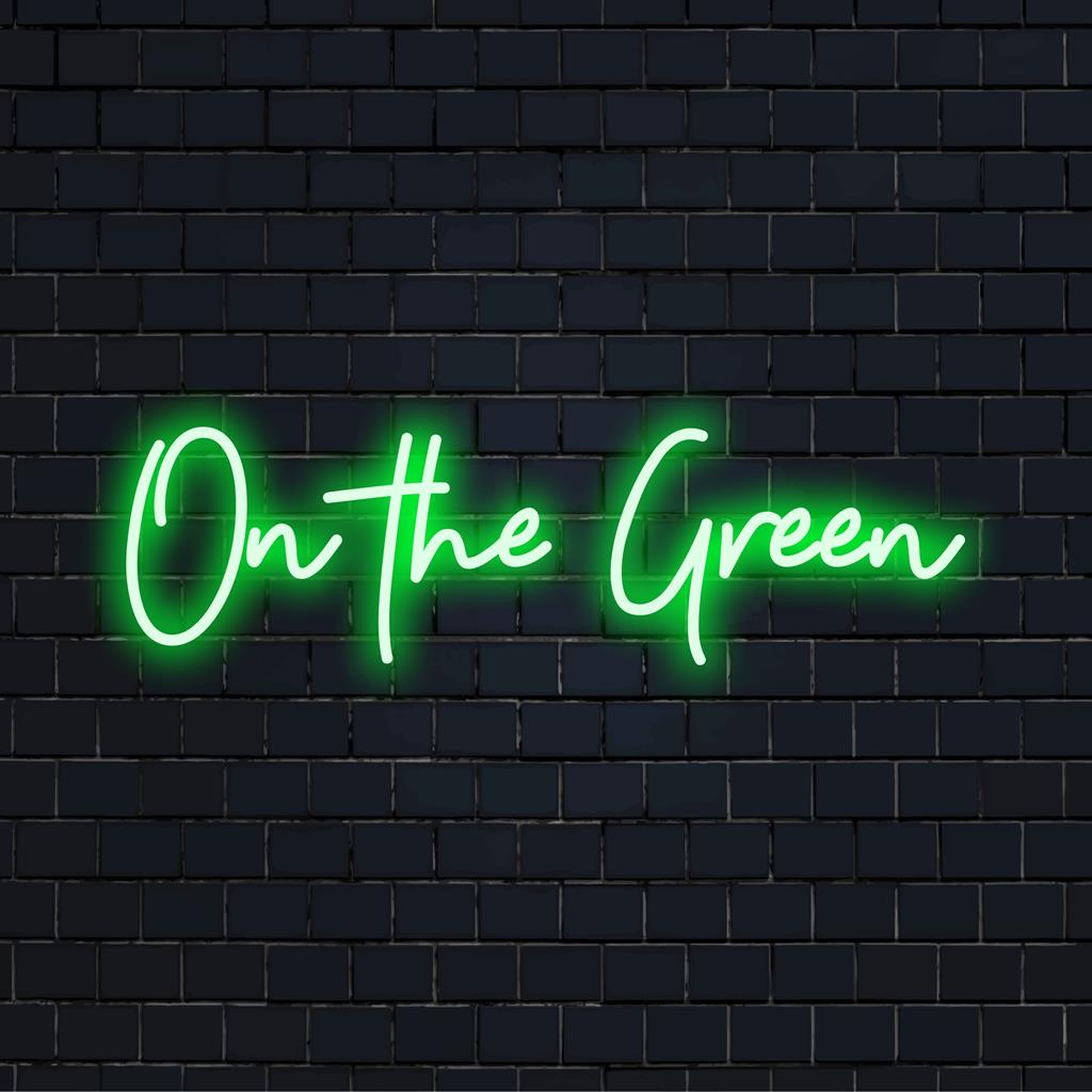 Vibrant custom LED neon sign featuring the phrase On The Green, perfect for adding a unique, personalized touch to any space.