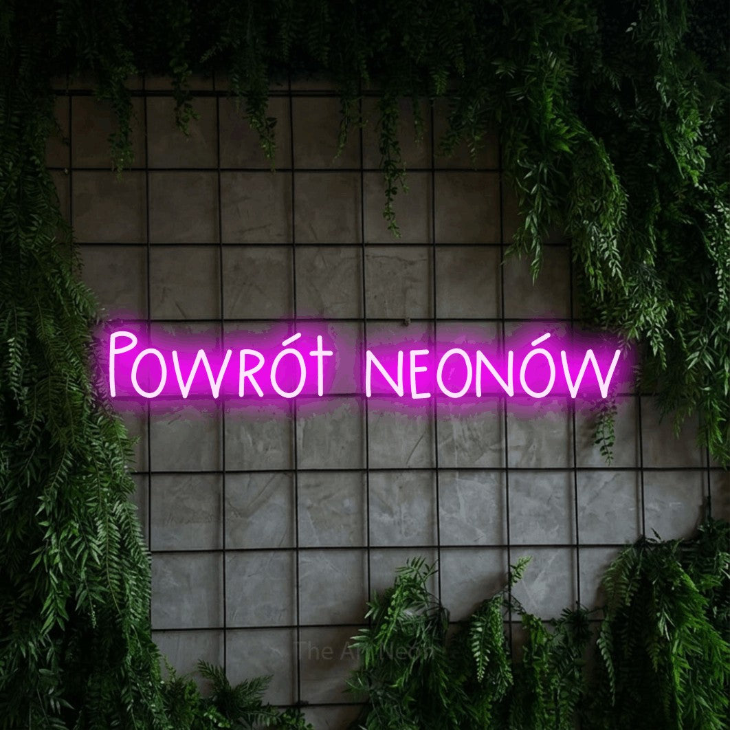LED neon sign reading “Powrót neonów”, arranged in a single line.