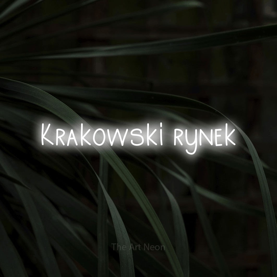 LED neon sign reading “Krakowski rynek”, arranged in a single line.