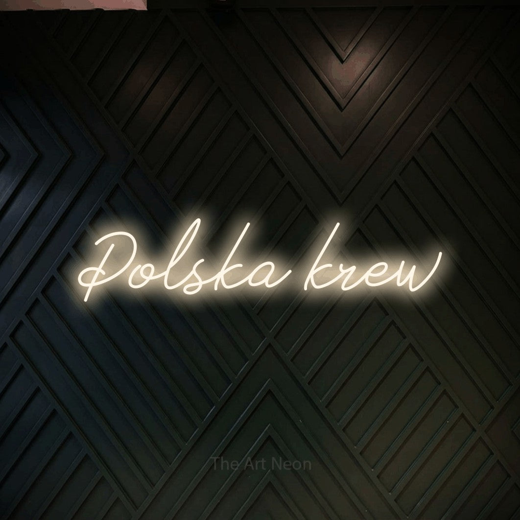 LED neon sign reading “Polska krew”, arranged in a single line.