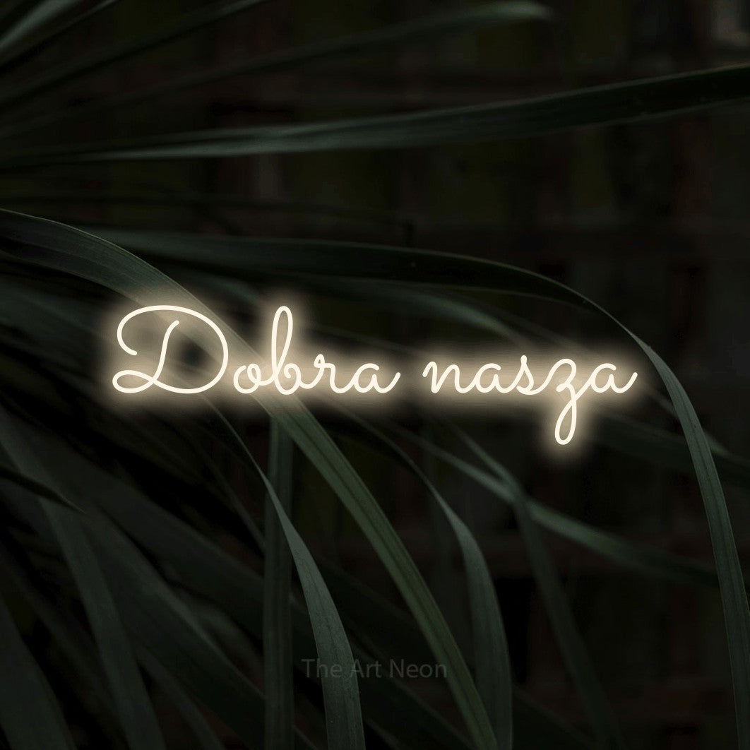 LED neon sign reading “Dobra nasza”, arranged in a single line.