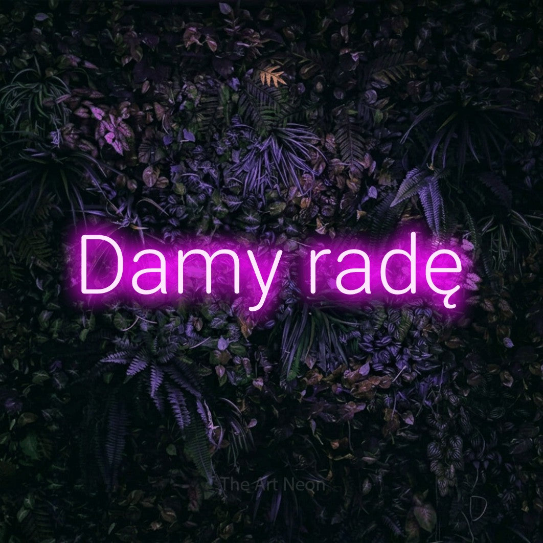 LED neon sign reading “Damy radę”, arranged in a single line.