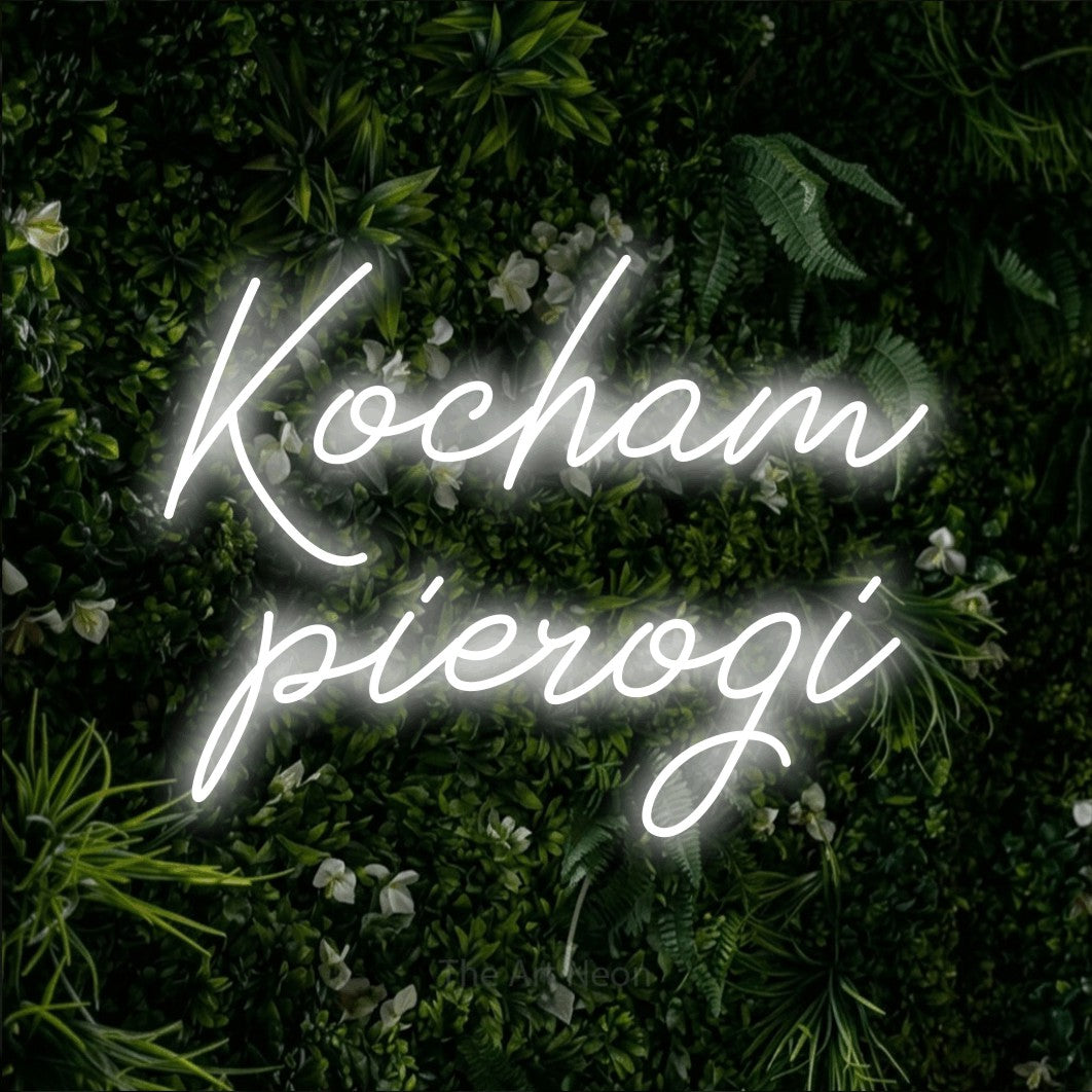 LED neon sign reading “Kocham pierogi”, arranged in two lines.