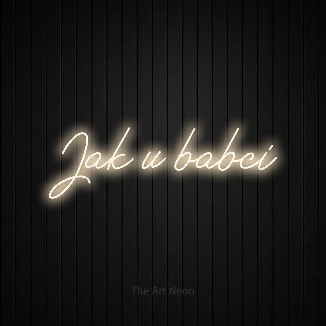 LED neon sign reading “Jak u babci”, arranged in a single line.
