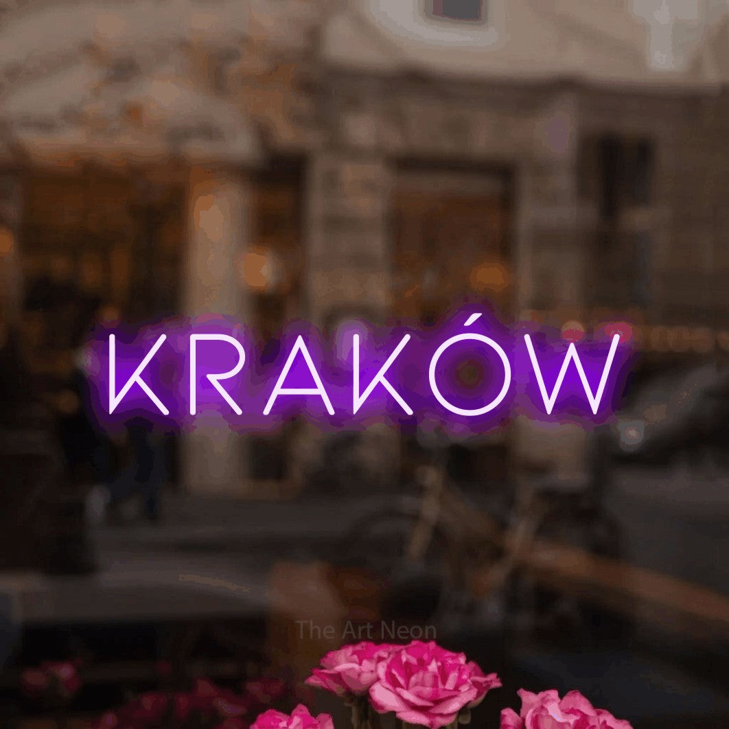 LED neon sign reading “Kraków”, arranged in a single line.