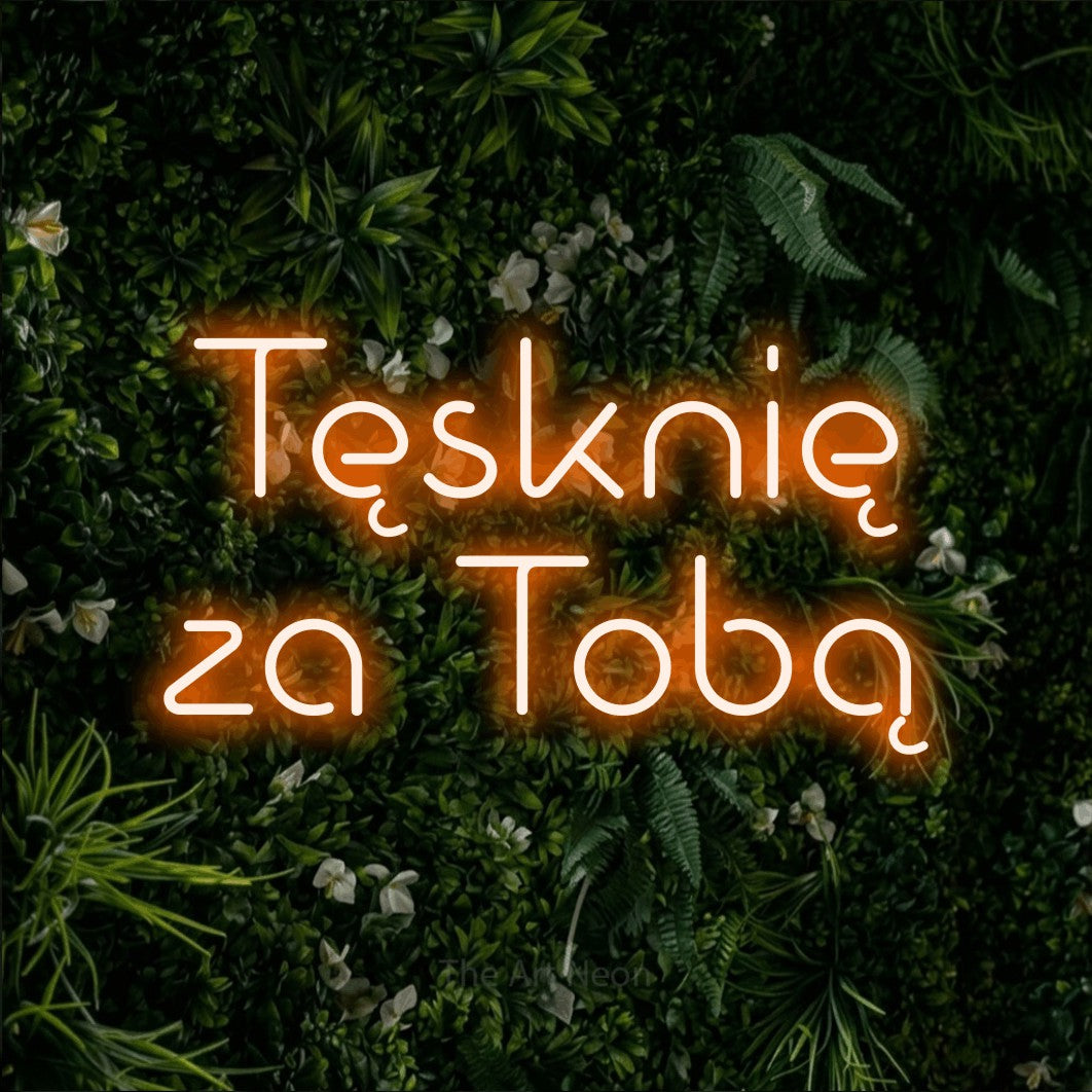 LED neon sign reading “Tęsknię za Tobą”, arranged in two lines.