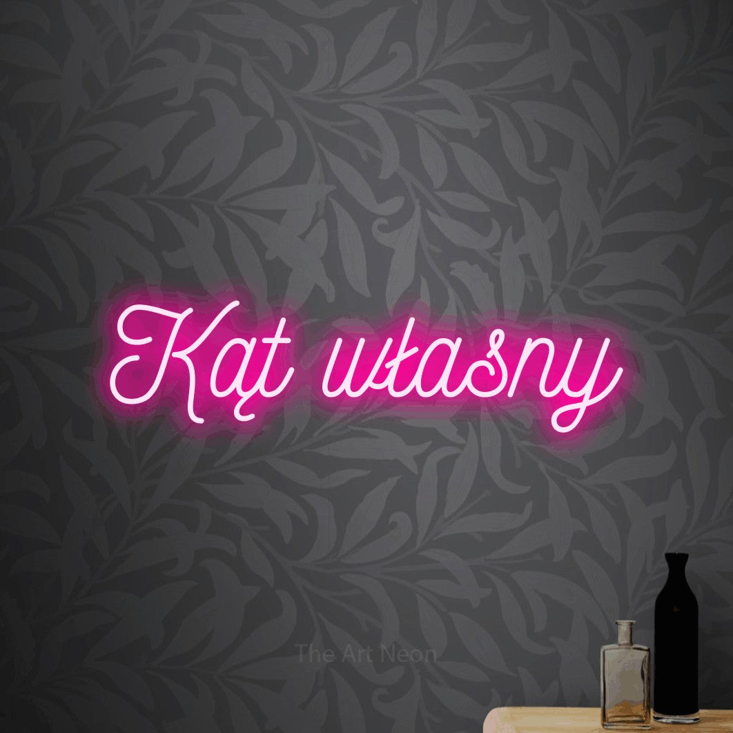 LED neon sign reading “Kąt własny”, arranged in a single line.