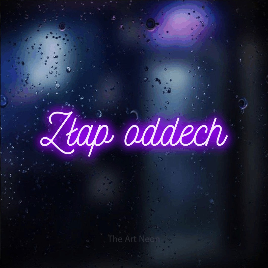LED neon sign reading “Złap oddech”, arranged in a single line.