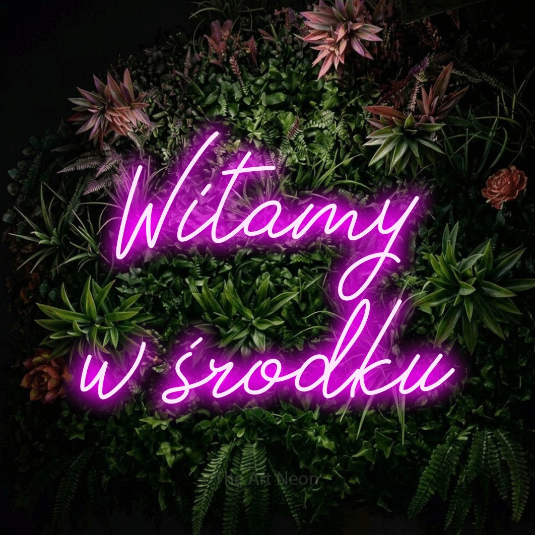 LED neon sign reading “Witamy w środku”, arranged in two lines.