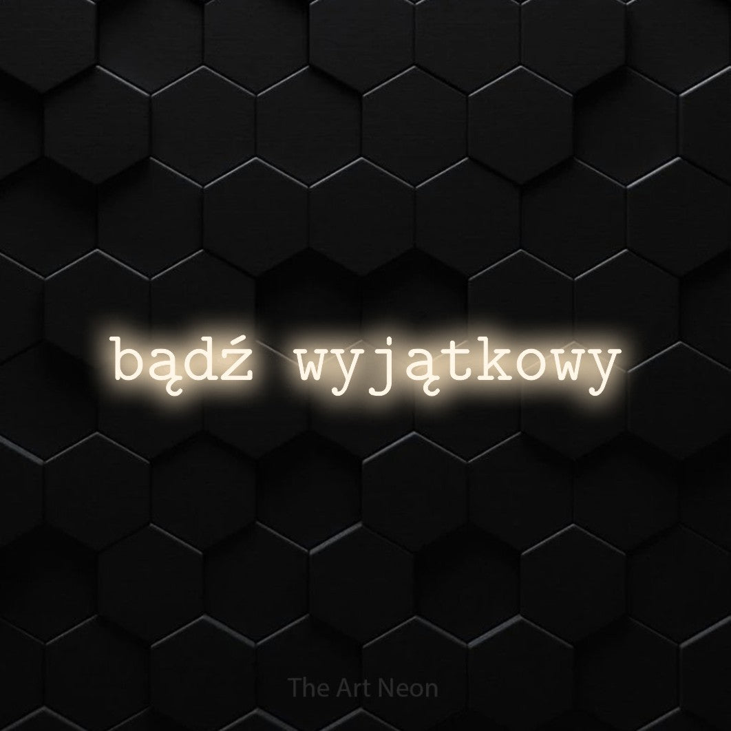 LED neon sign reading “bądź wyjątkowy”, arranged in a single line.
