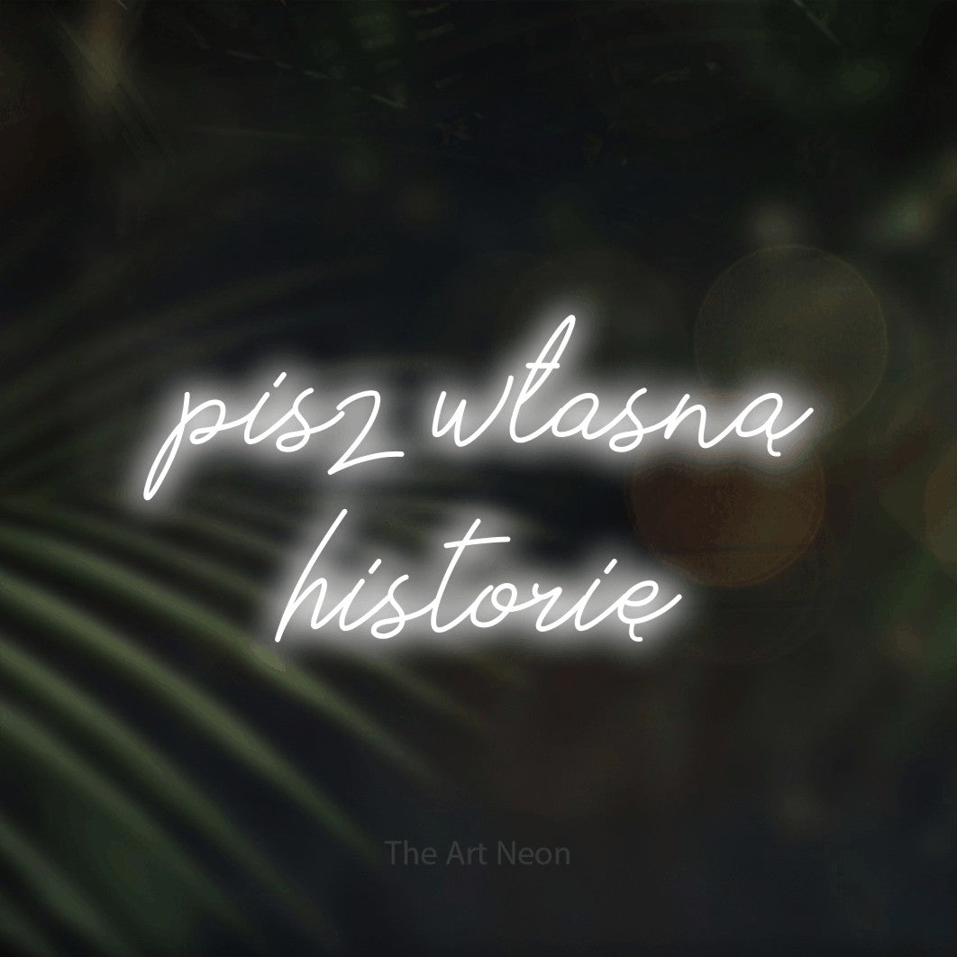 LED neon sign reading “pisz własną historię”, arranged in two lines.