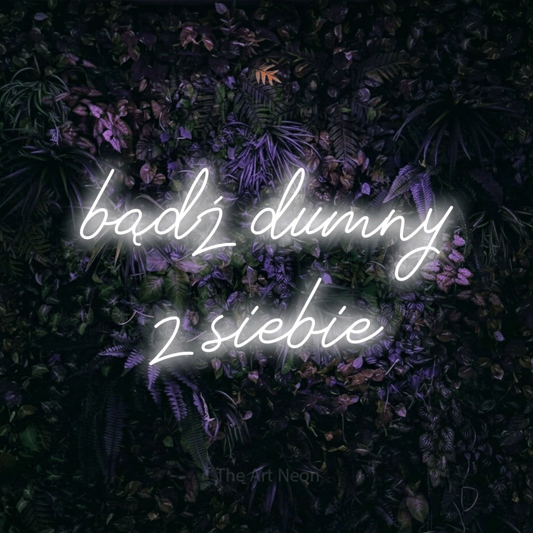 LED neon sign reading “bądź dumny z siebie”, arranged in two lines.
