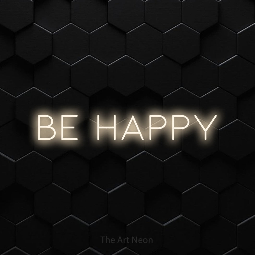 LED neon sign reading “be happy”, arranged in a single line.