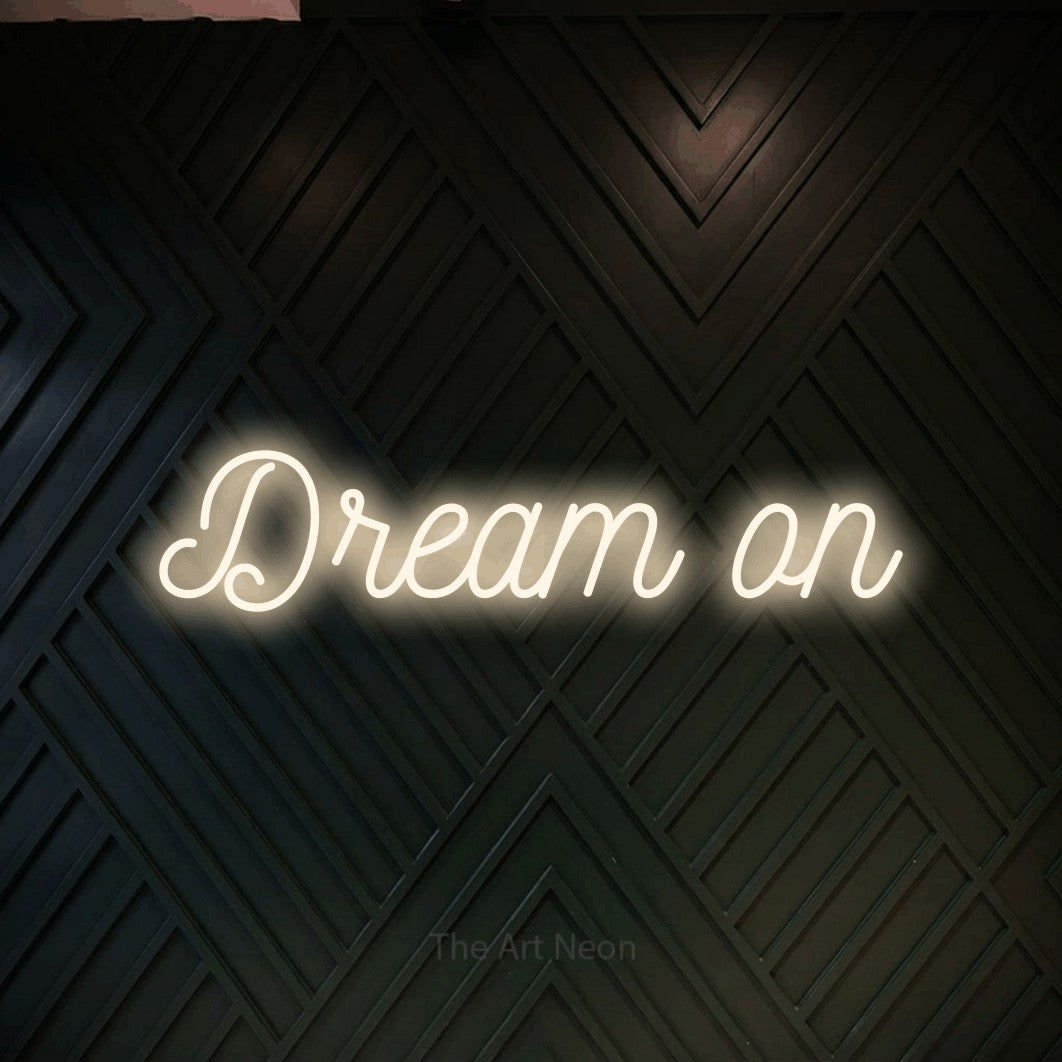 LED neon sign reading “Dream on”, arranged in a single line.