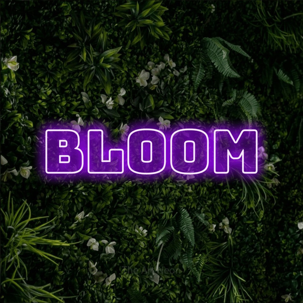 LED neon sign reading “Bloom”, arranged in a single line.