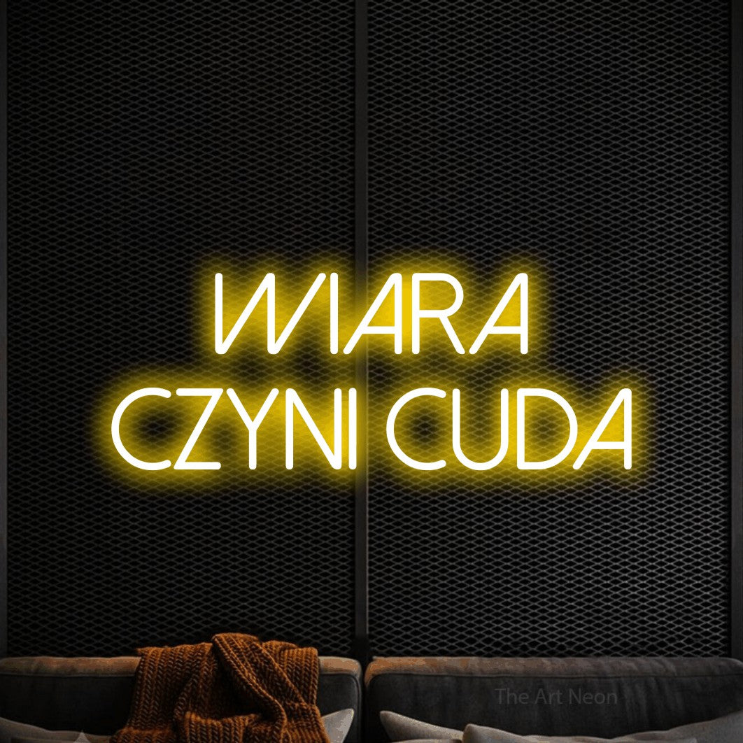 LED neon sign reading “wiara czyni cuda”, arranged in two lines.