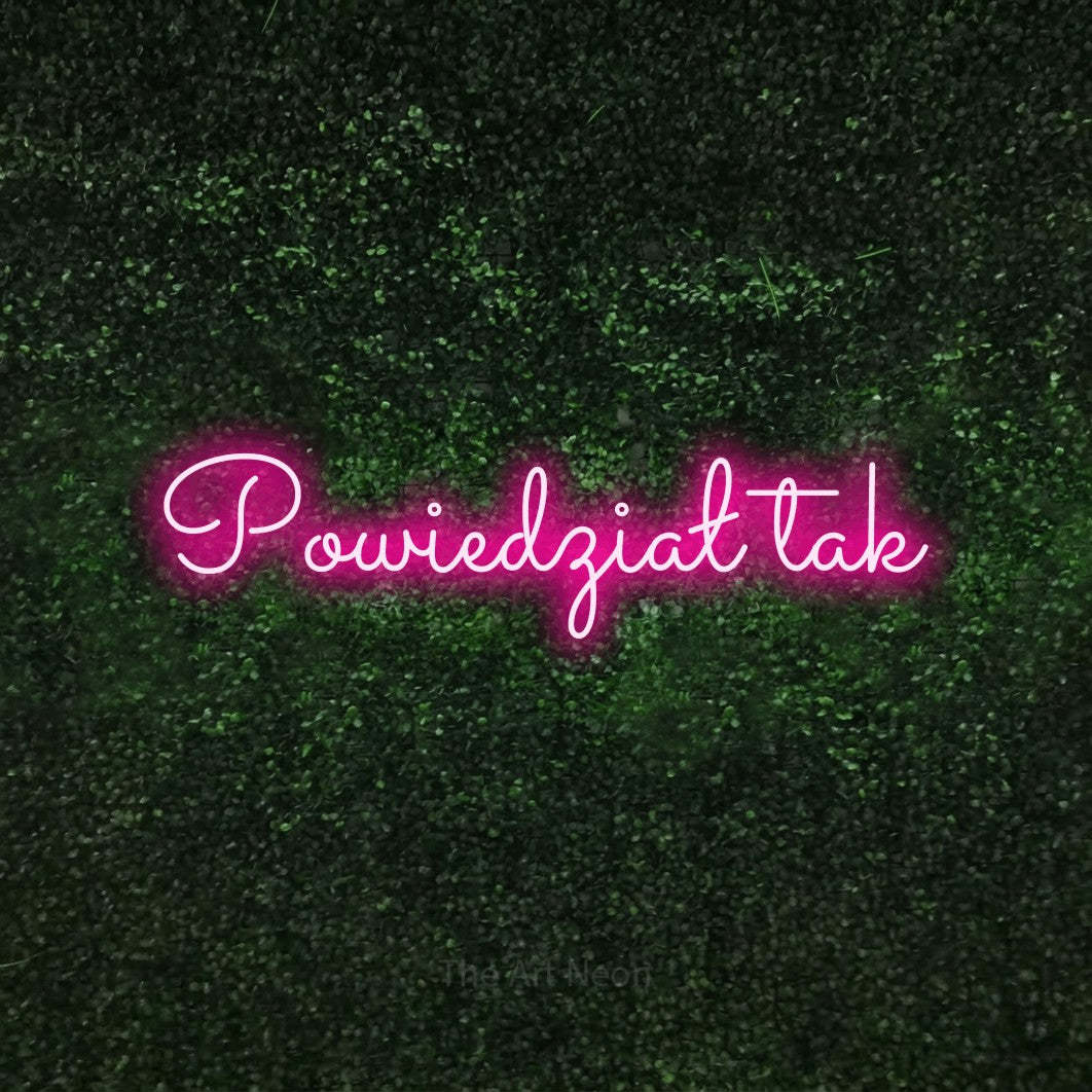 LED neon sign reading “Powiedział tak”, arranged in a single line.