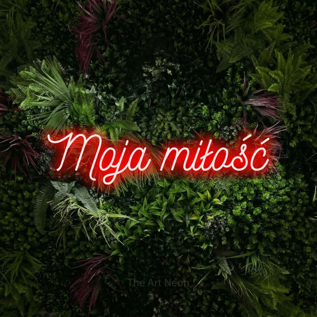 LED neon sign reading “Moja miłość”, arranged in a single line.