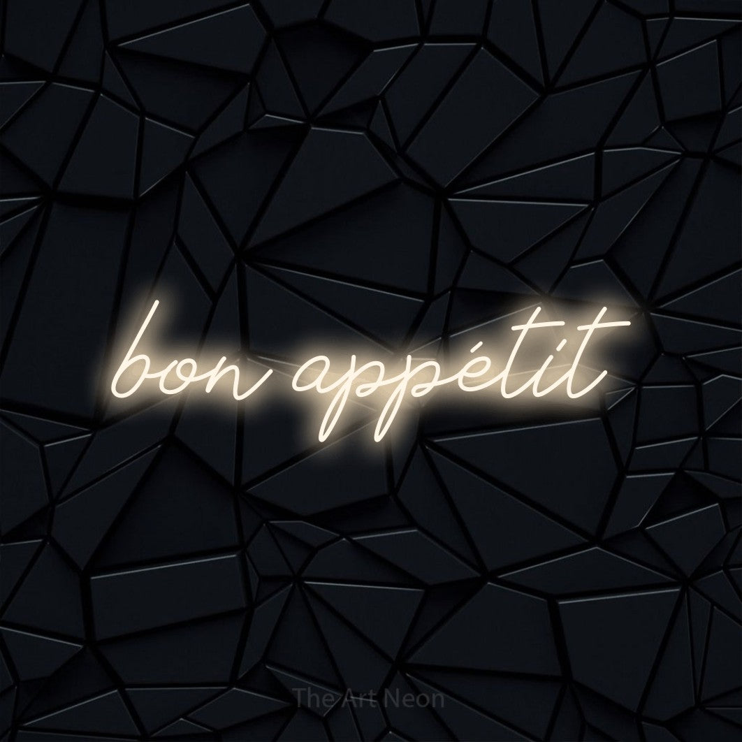 LED neon sign reading “bon appétit”, arranged in a single line.