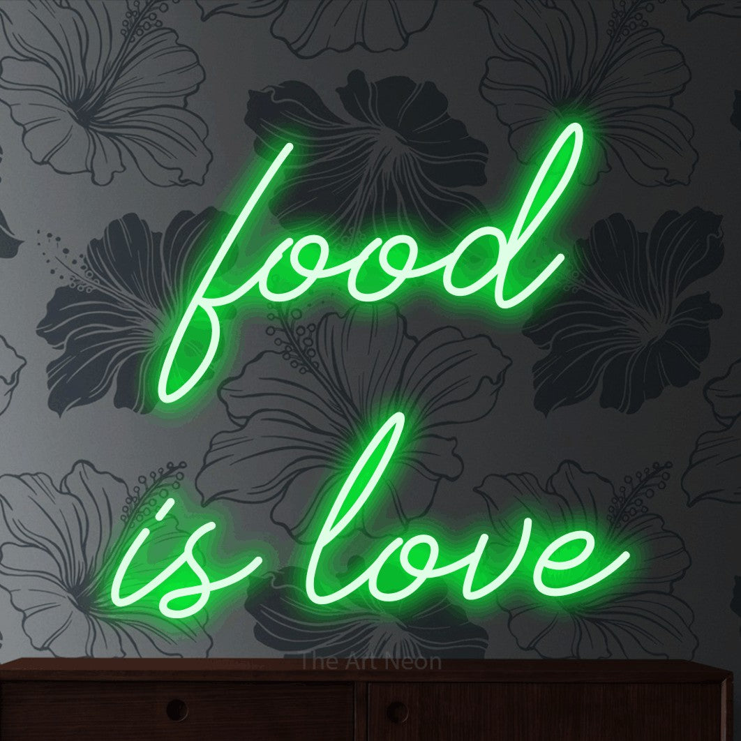 LED neon sign reading “food is love”, arranged in two lines.
