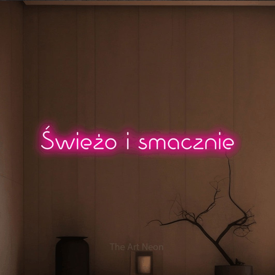 LED neon sign reading “Świeżo i smacznie”, arranged in a single line.