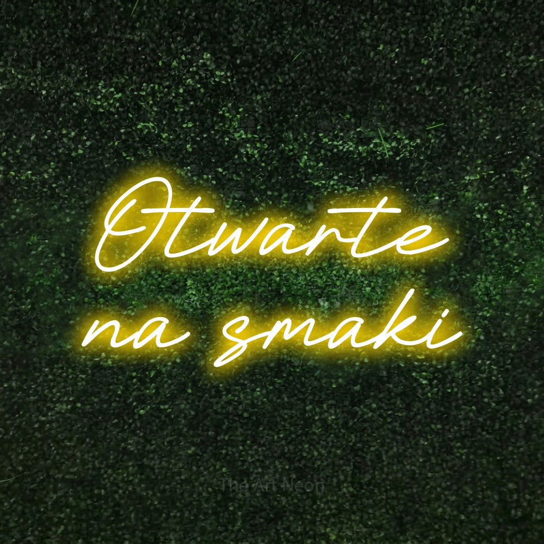 LED neon sign reading “Otwarte na smaki”, arranged in two lines.