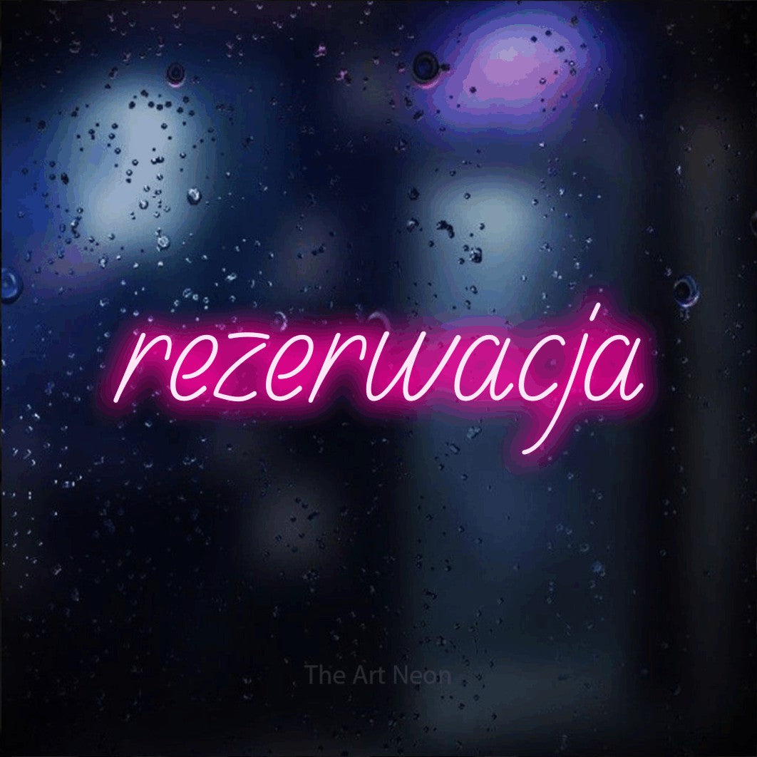 LED neon sign reading “rezerwacja”, arranged in a single line.
