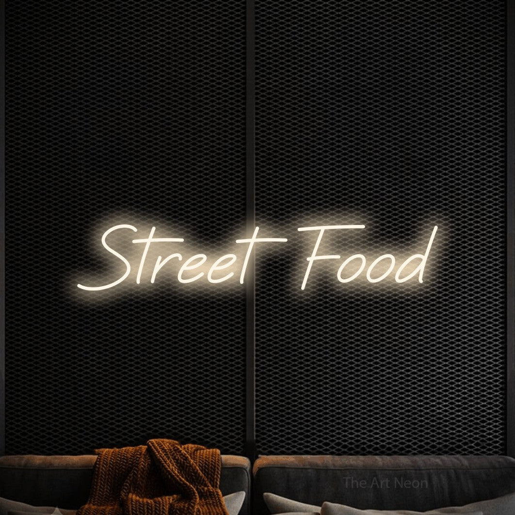 LED neon sign reading “Street Food”, arranged in a single line.