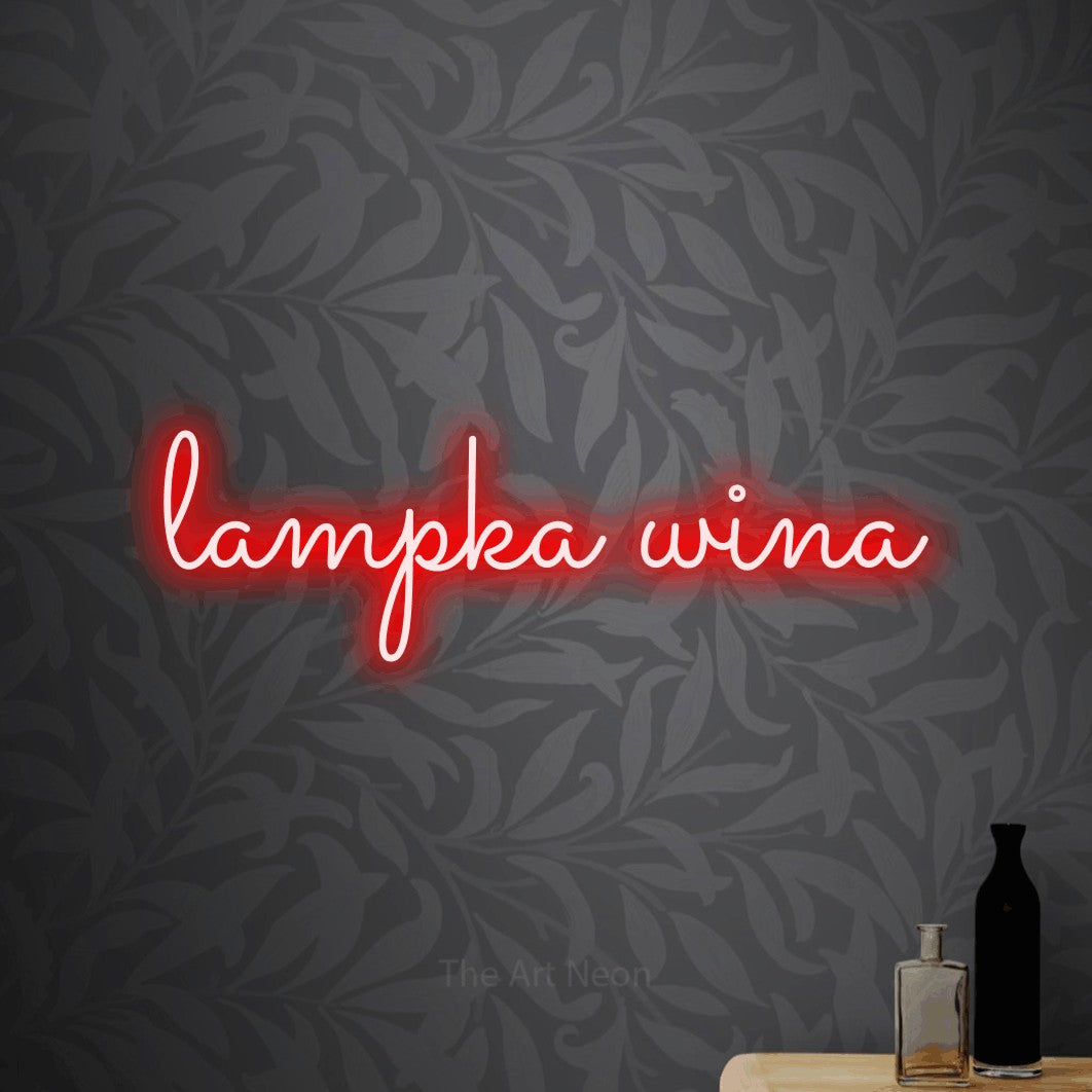 LED neon sign reading “lampka wina”, arranged in a single line.