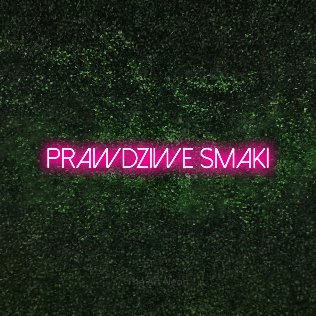 LED neon sign reading “Prawdziwe smaki”, arranged in a single line.