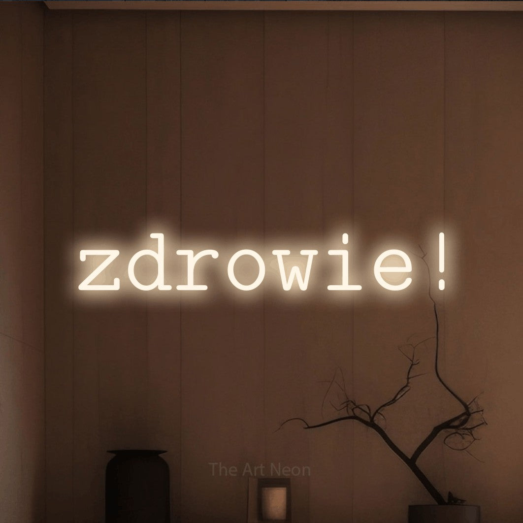 LED neon sign reading “zdrowie!”, arranged in a single line.