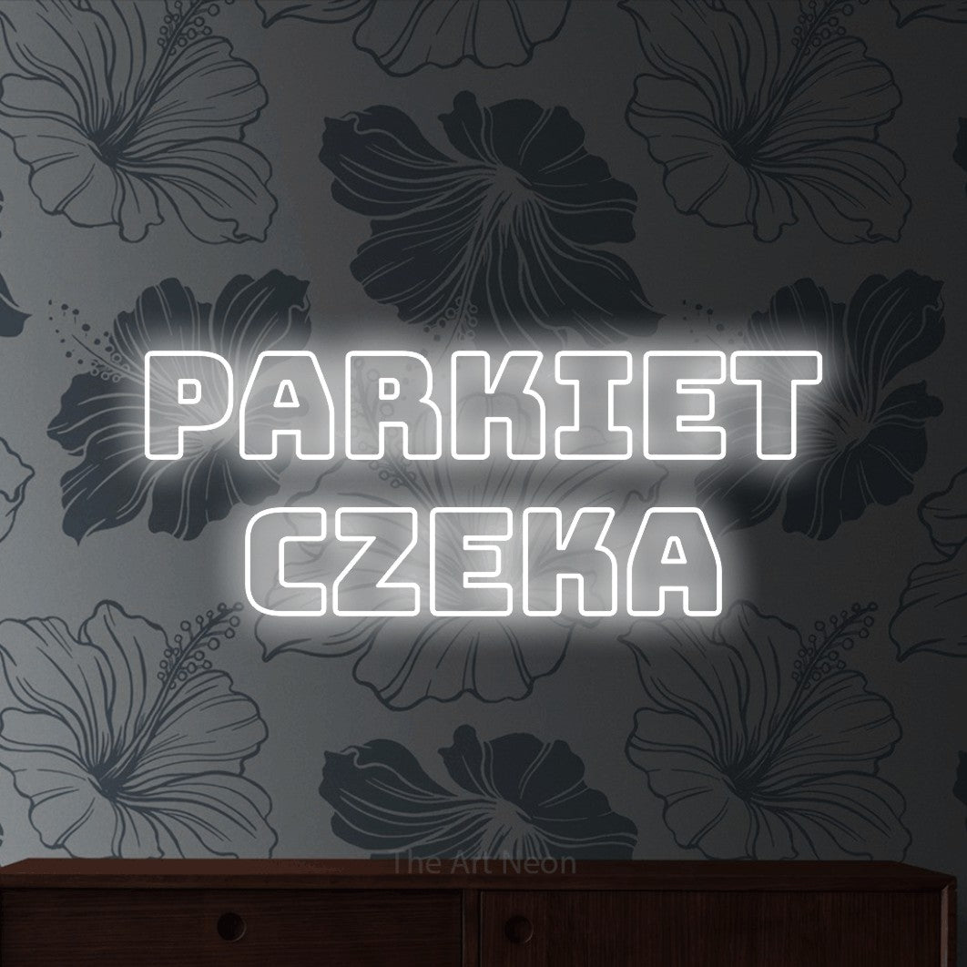 LED neon sign reading “PARKIET CZEKA”, arranged in two lines.