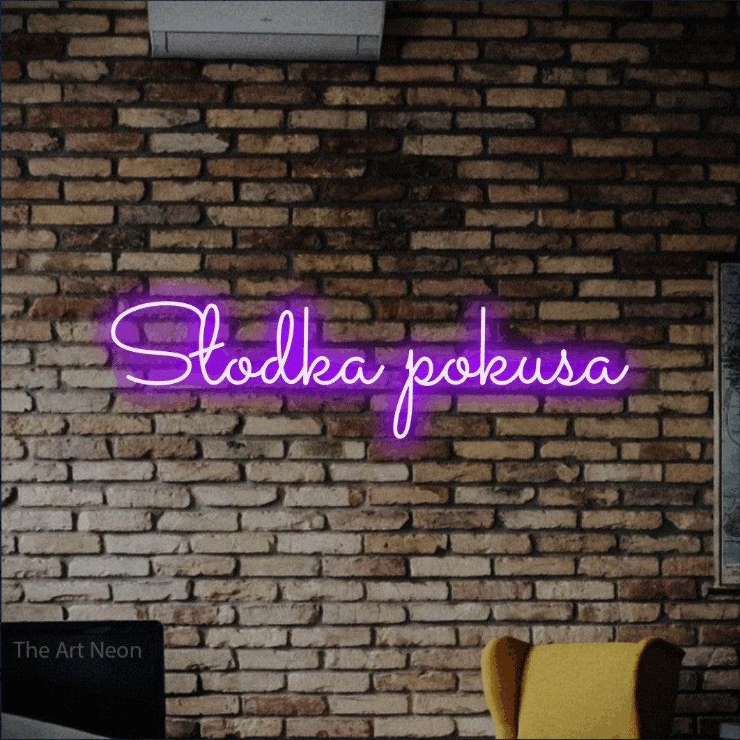 LED neon sign reading “Słodka pokusa”, arranged in a single line.