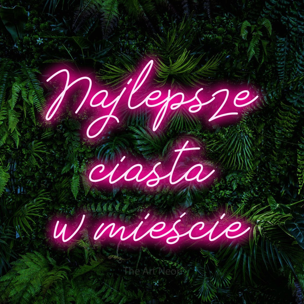 LED neon sign reading “Najlepsze ciasta w mieście”, arranged in three lines.