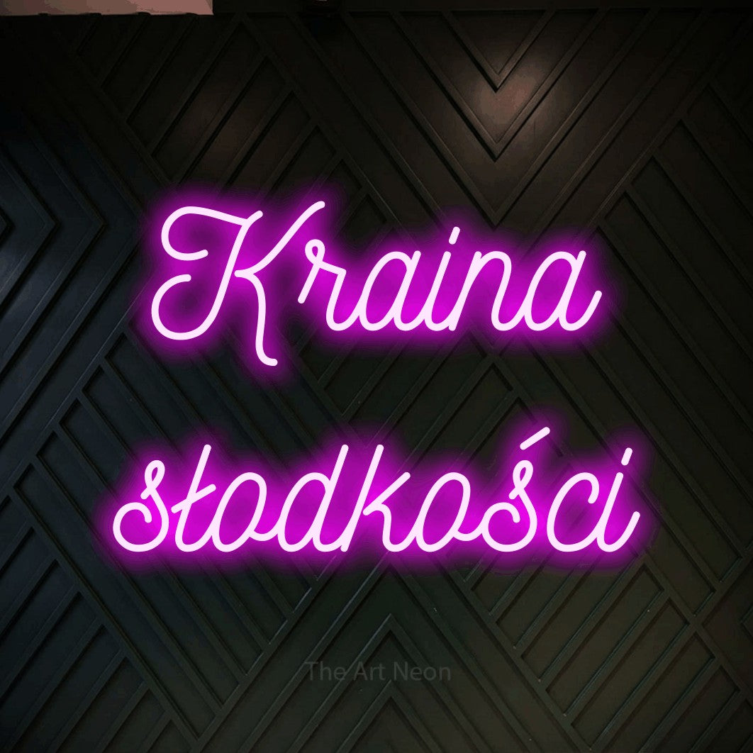 LED neon sign reading “Kraina słodkości”, arranged in two lines.