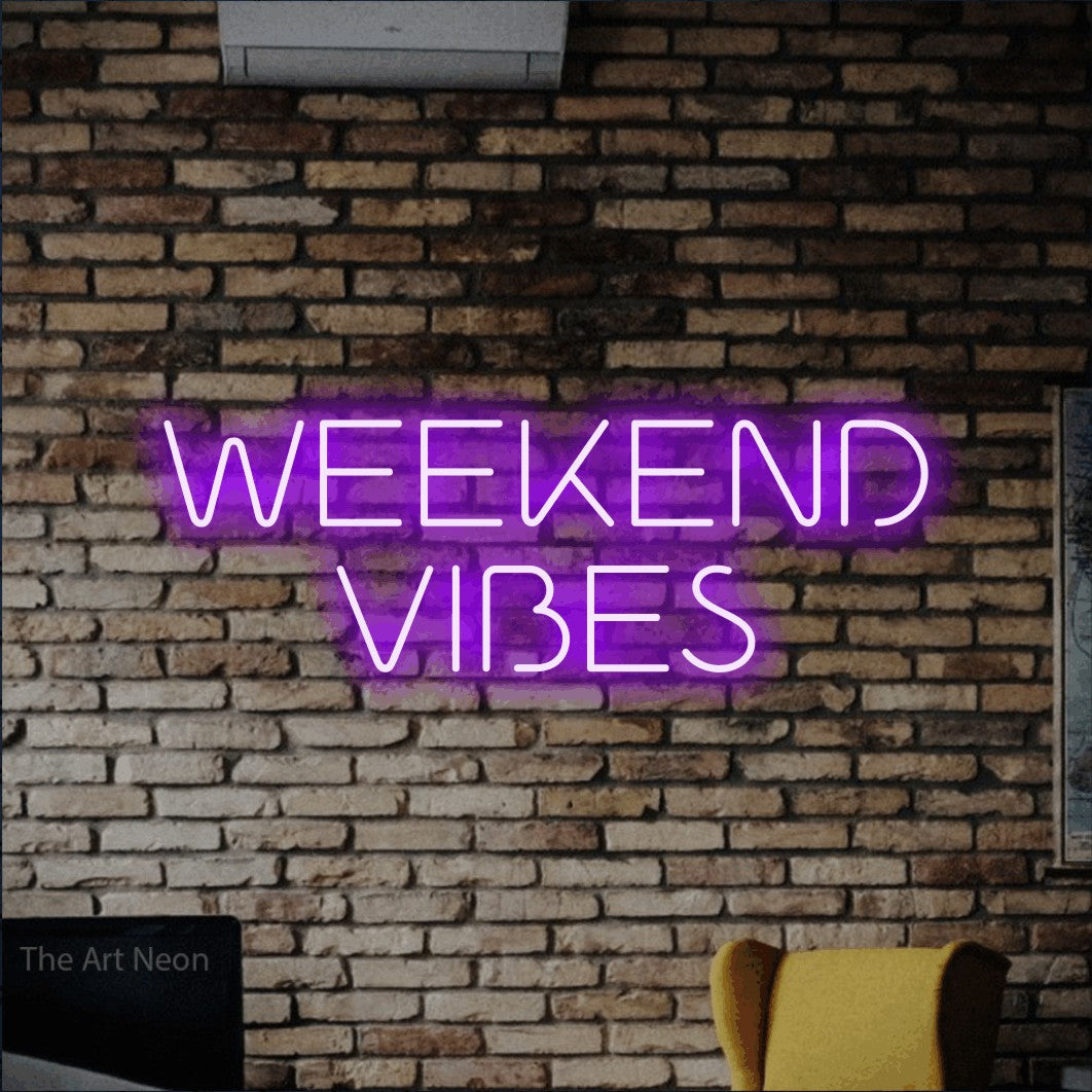 LED neon sign reading “WEEKEND VIBES”, arranged in two lines.