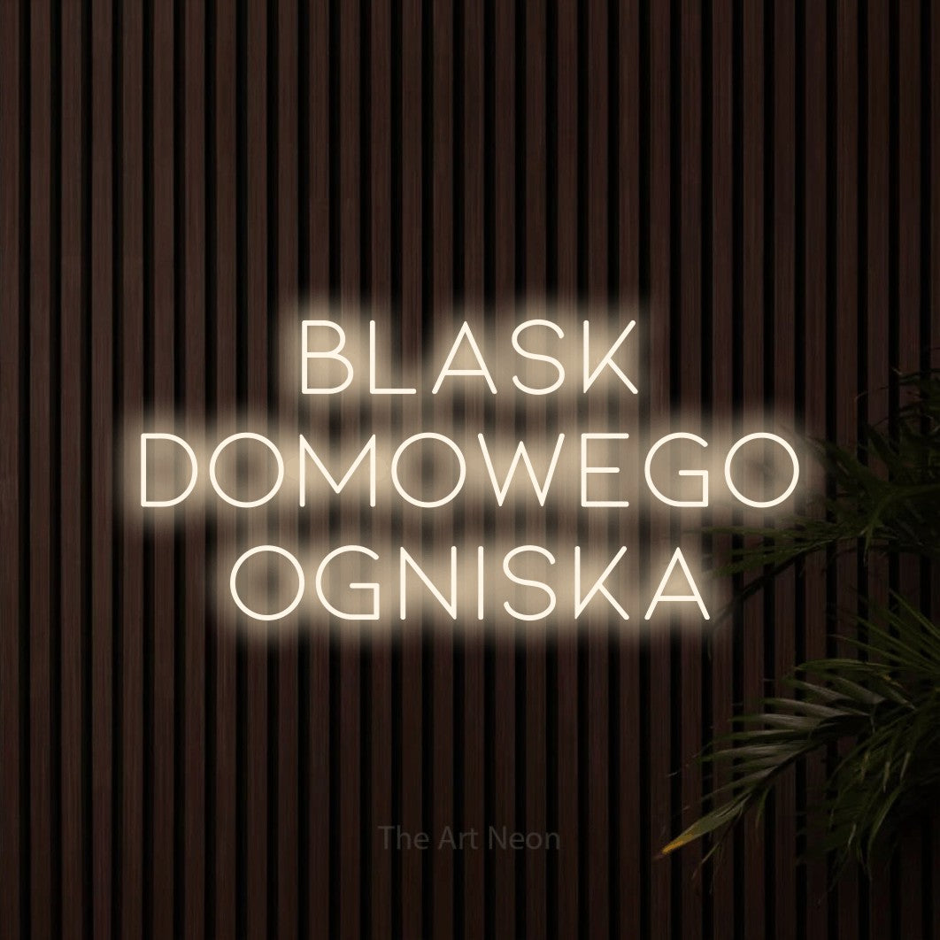 LED neon sign reading “Blask domowego ogniska”, arranged in three lines.