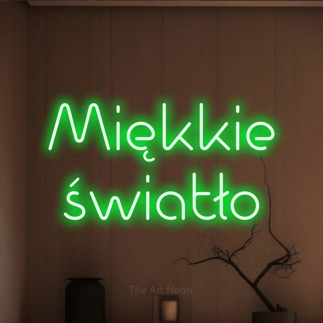 LED neon sign reading “Miękkie światło”, arranged in two lines.