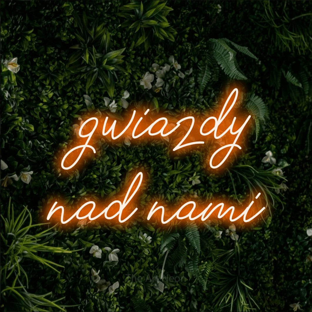 LED neon sign reading “gwiazdy nad nami”, arranged in two lines.