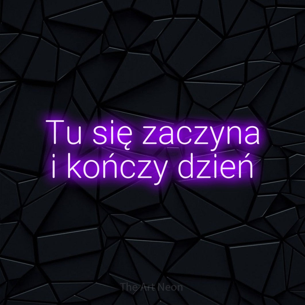 LED neon sign reading “Tu się zaczyna i kończy dzień”, arranged in two lines.