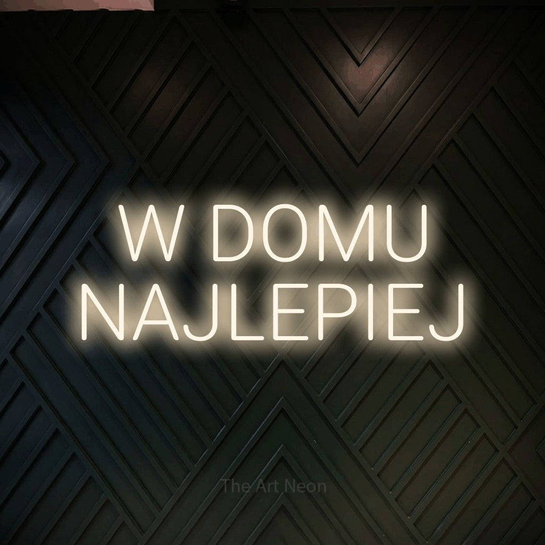 LED neon sign reading “W DOMU NAJLEPIEJ”, arranged in two lines.