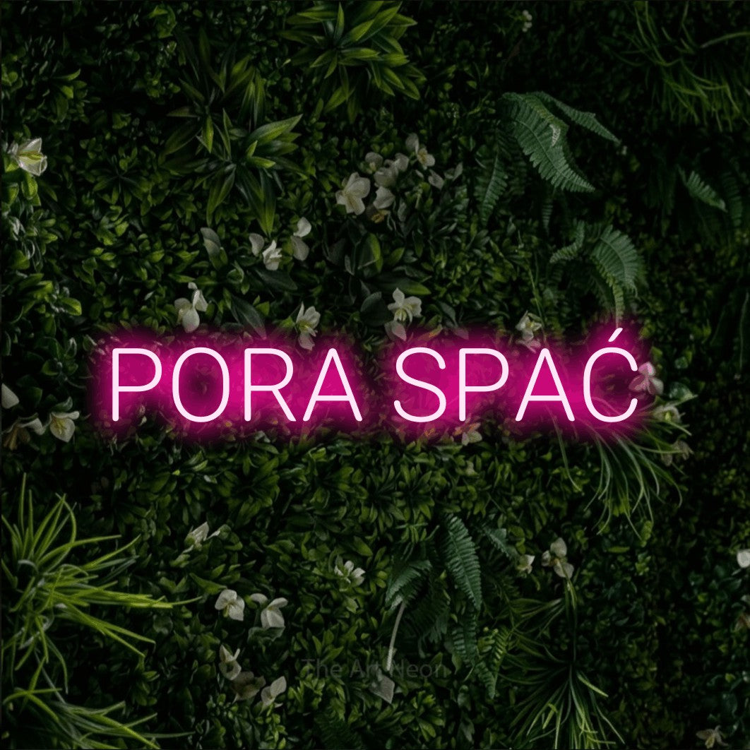 LED neon sign reading “PORA SPAĆ”, arranged in a single line.