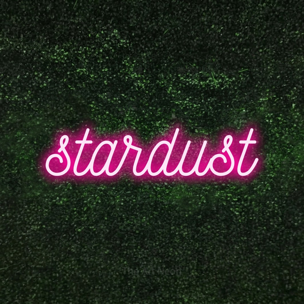 LED neon sign reading “stardust”, arranged in a single line.