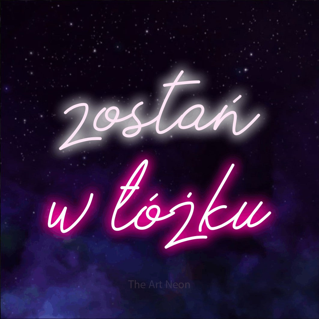 LED neon sign reading “zostań w łóżku”, arranged in two lines.