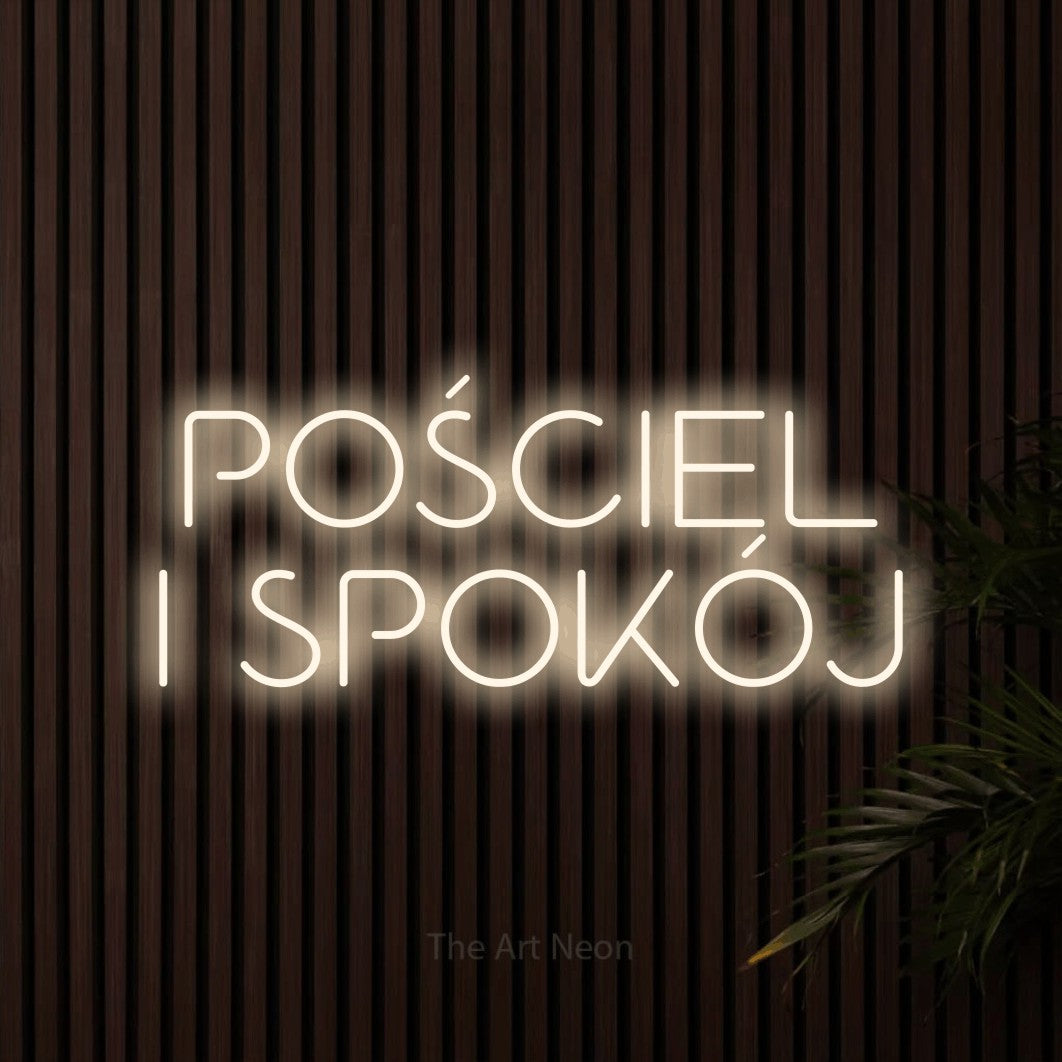 LED neon sign reading “POŚCIEL I SPOKÓJ”, arranged in two lines.