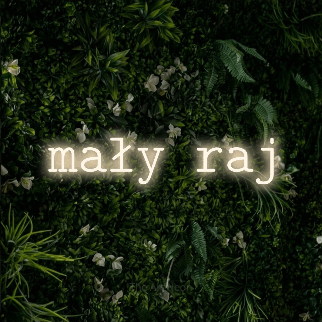 LED neon sign reading “mały raj”, arranged in a single line.